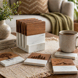Set of wooden coasters with natural patterns on a table with a mug and books.