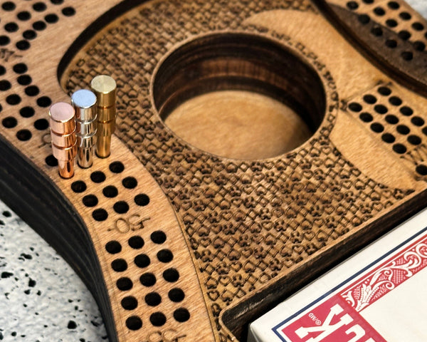 metals sitting on a cribbage board