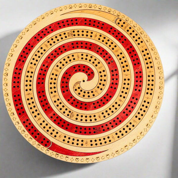 Wooden cribbage board with concentric circles on a gray background