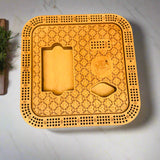 Wooden cribbage board with intricate patterns on a gray background