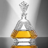 Crystal decanter with geometric design on a reflective surface