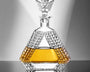 Crystal decanter with geometric design on a reflective surface